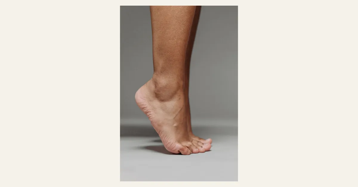Side view of a bare foot on tiptoe showing a high medial arch — best shoes for high arches, Podiatrist Tested